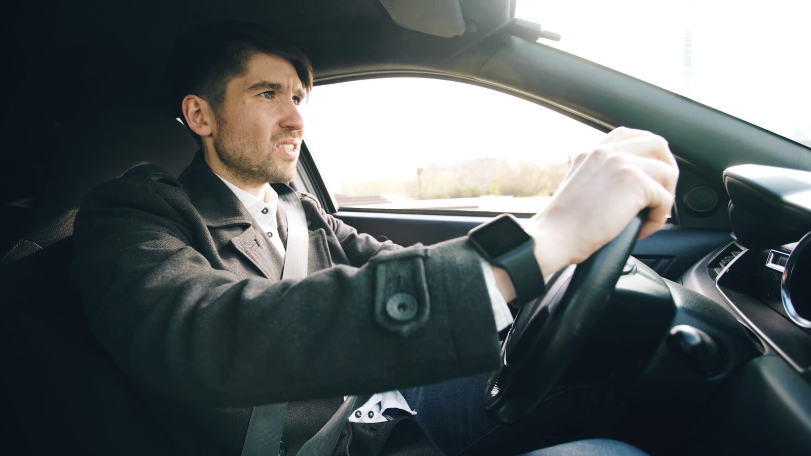 Man driving a car with intensity
